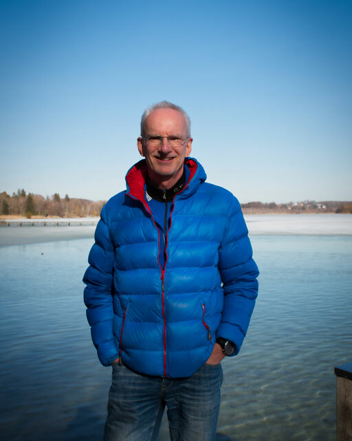 Ice swimming at Wörthsee Uwe-Carsten Fiebig with warm winter jacket on the shore of the Wörthsee