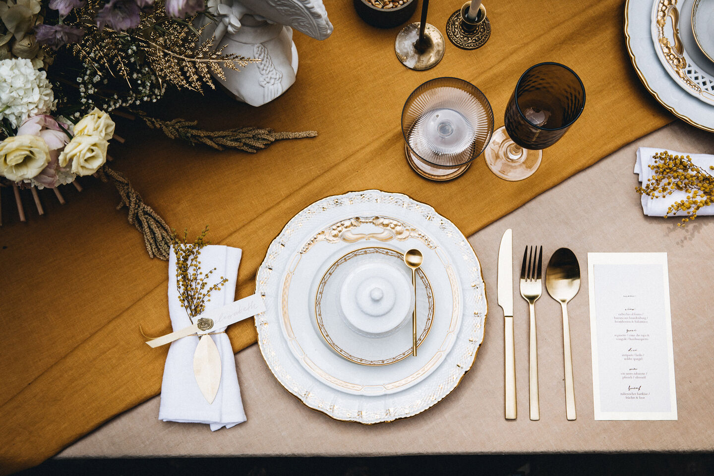 Dining with style: Inspiration for a beautiful, stylishly laid table View from above on set table with plates, silverware and glasses