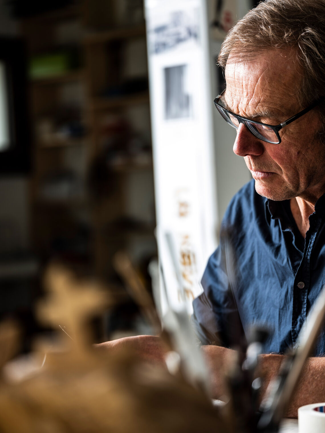 Profile of Hans Panschar, concentrated at work