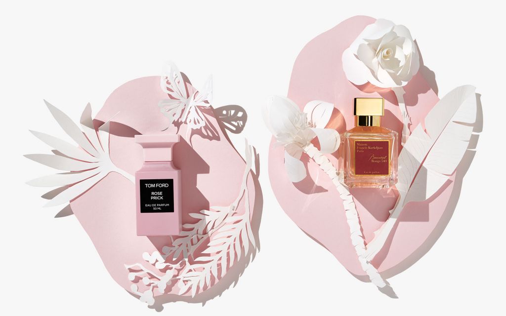 LUDWIG BECK Beauty: Fragrance photo shoot for the spring/sommer 2020 edition Still life with 2 fragrances, white paperart on pink paper