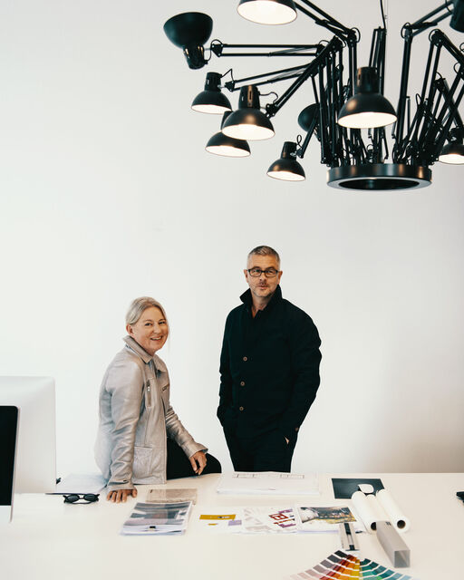 People for Munich: Ina and Gunther Laux in the M-Puls interview Ina and Gunther Laux at a large white desk in their architectural office